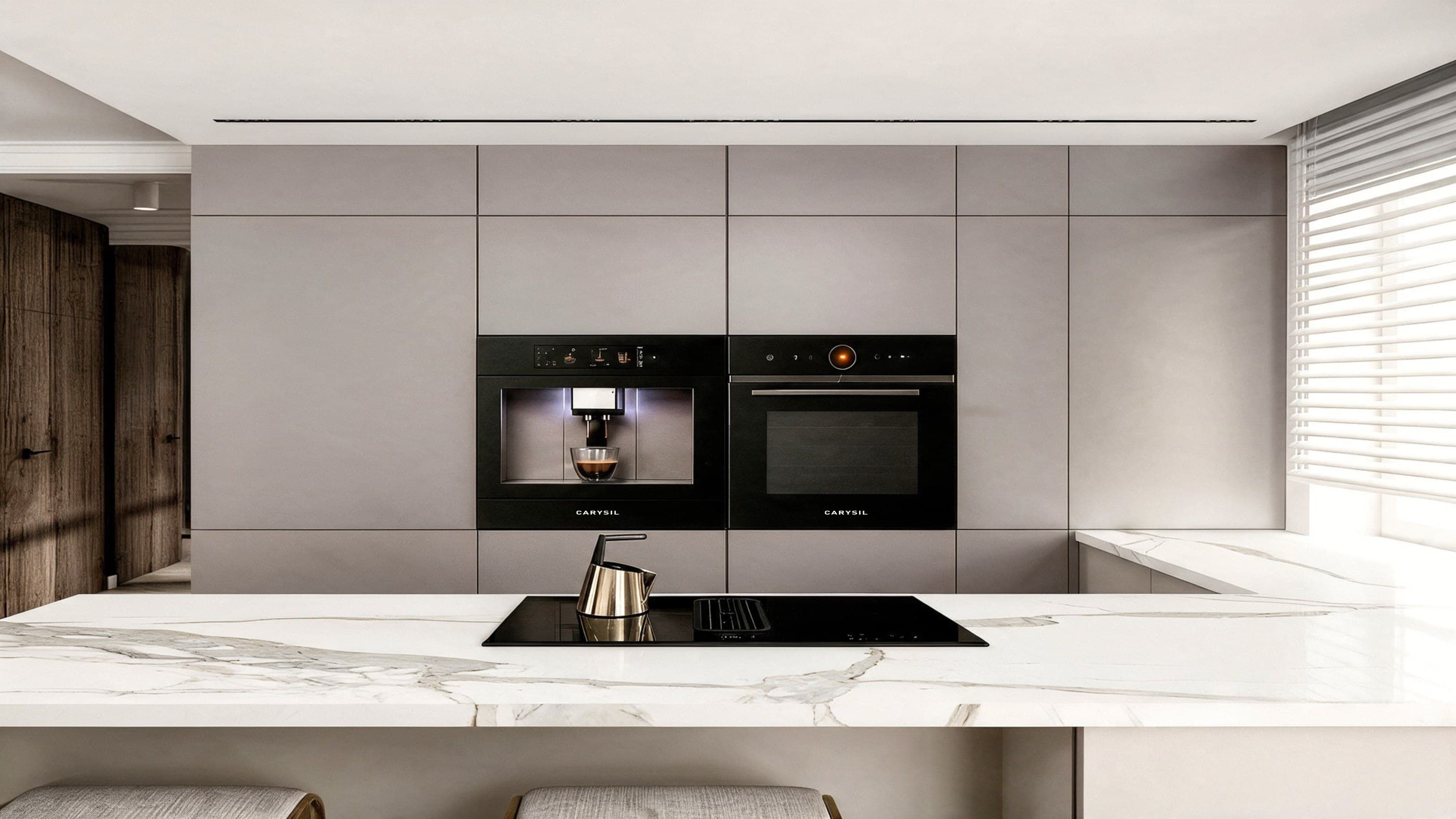 A Carysil built-in coffee machine, oven and induction hob