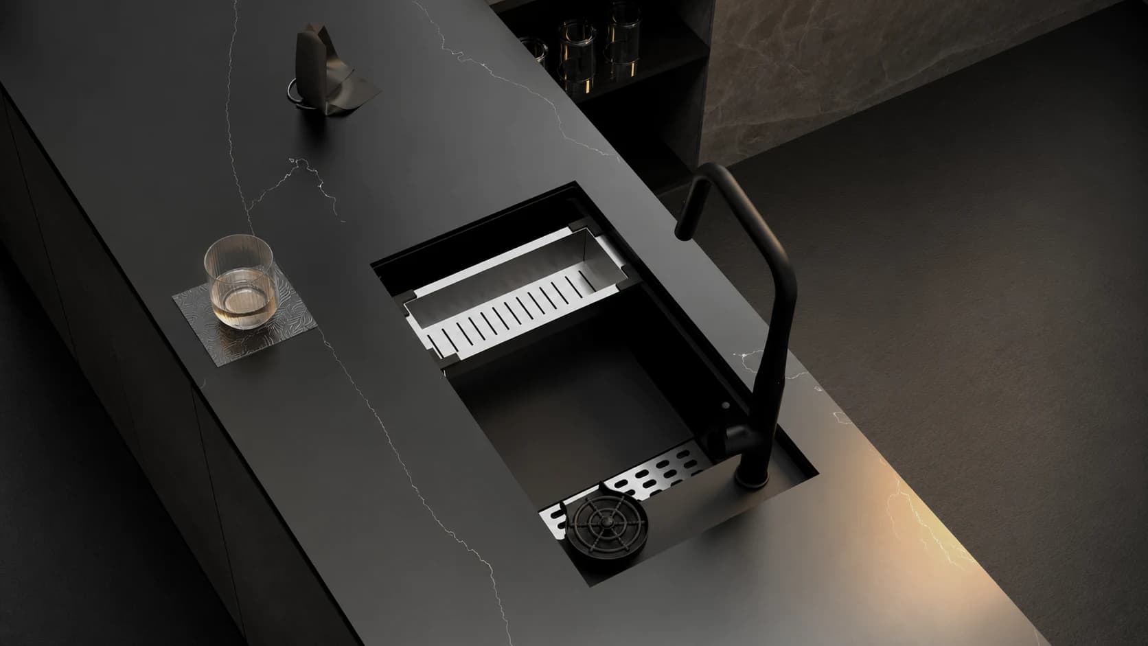 Carysil black quartz sink and faucet on a dark stone kitchen island