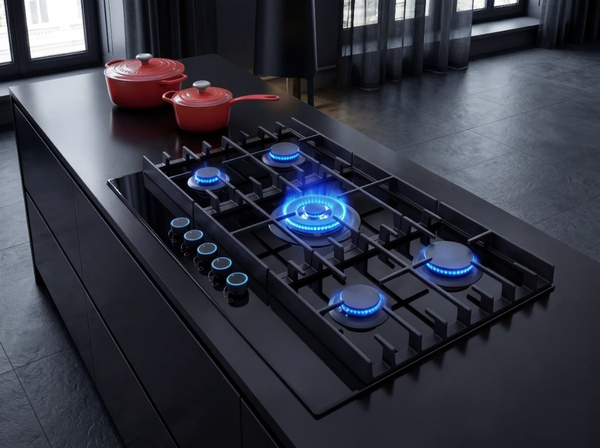 Carysil Matrix five-burner gas hob with blue flames on a dark kitchen island