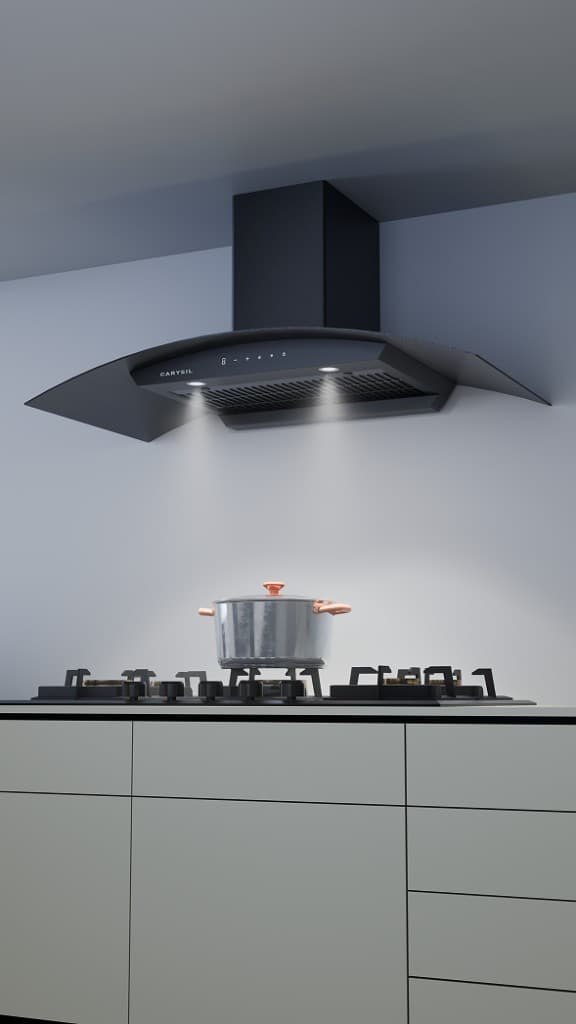 Curved black-glass Carysil chimney over a five-burner hob