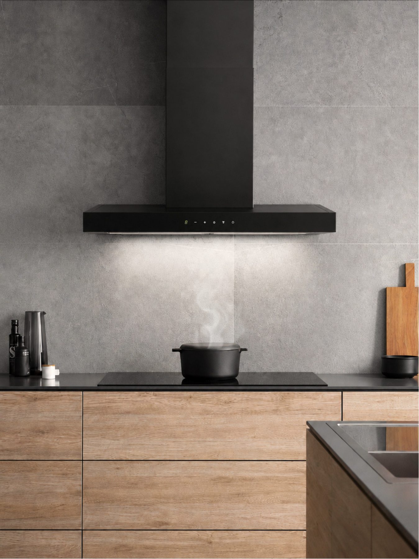Carysil wall-mounted chimney above a hob in a timber kitchen